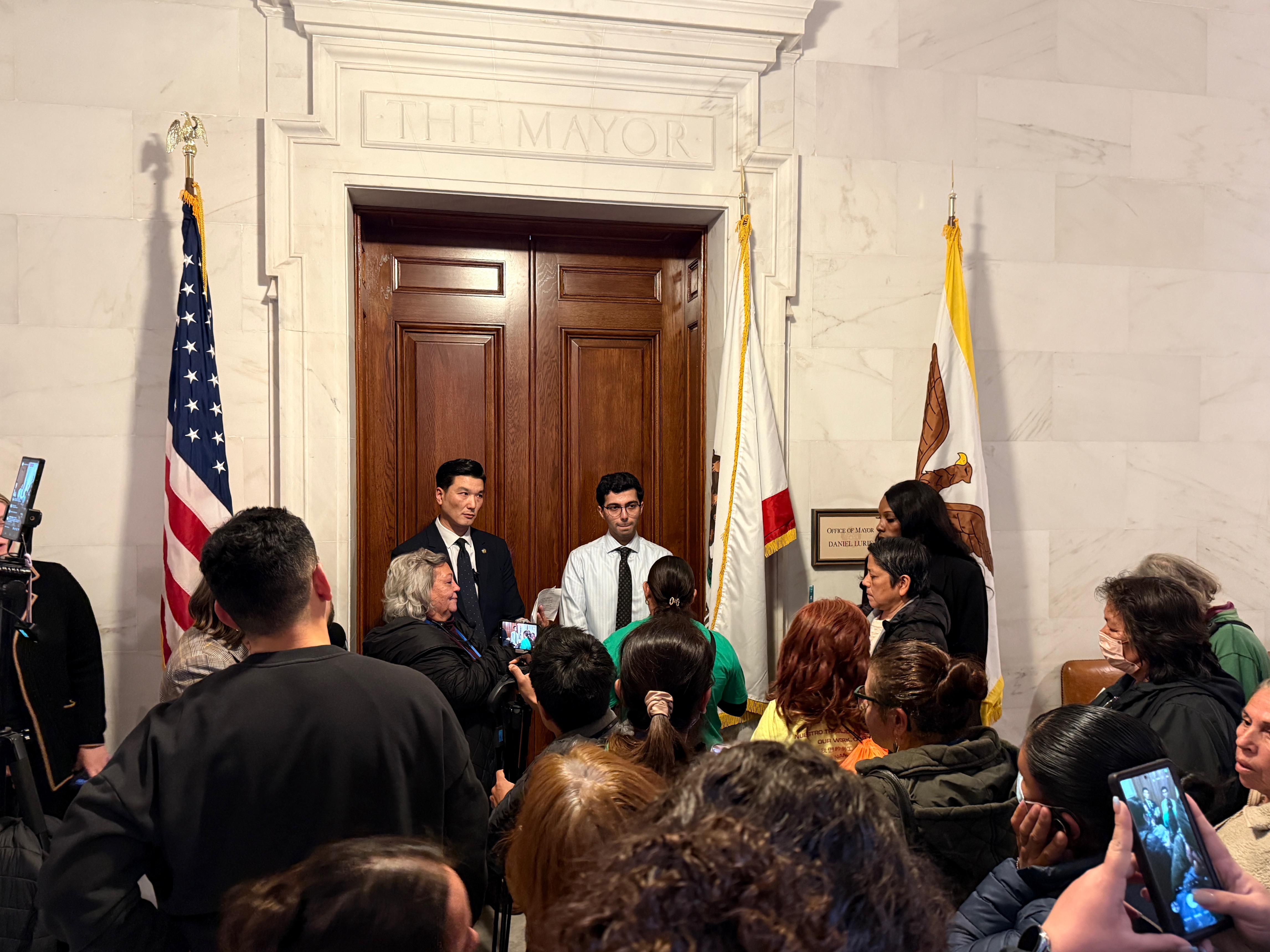 Protesting Mayor Lurie’s budget cuts outside his office