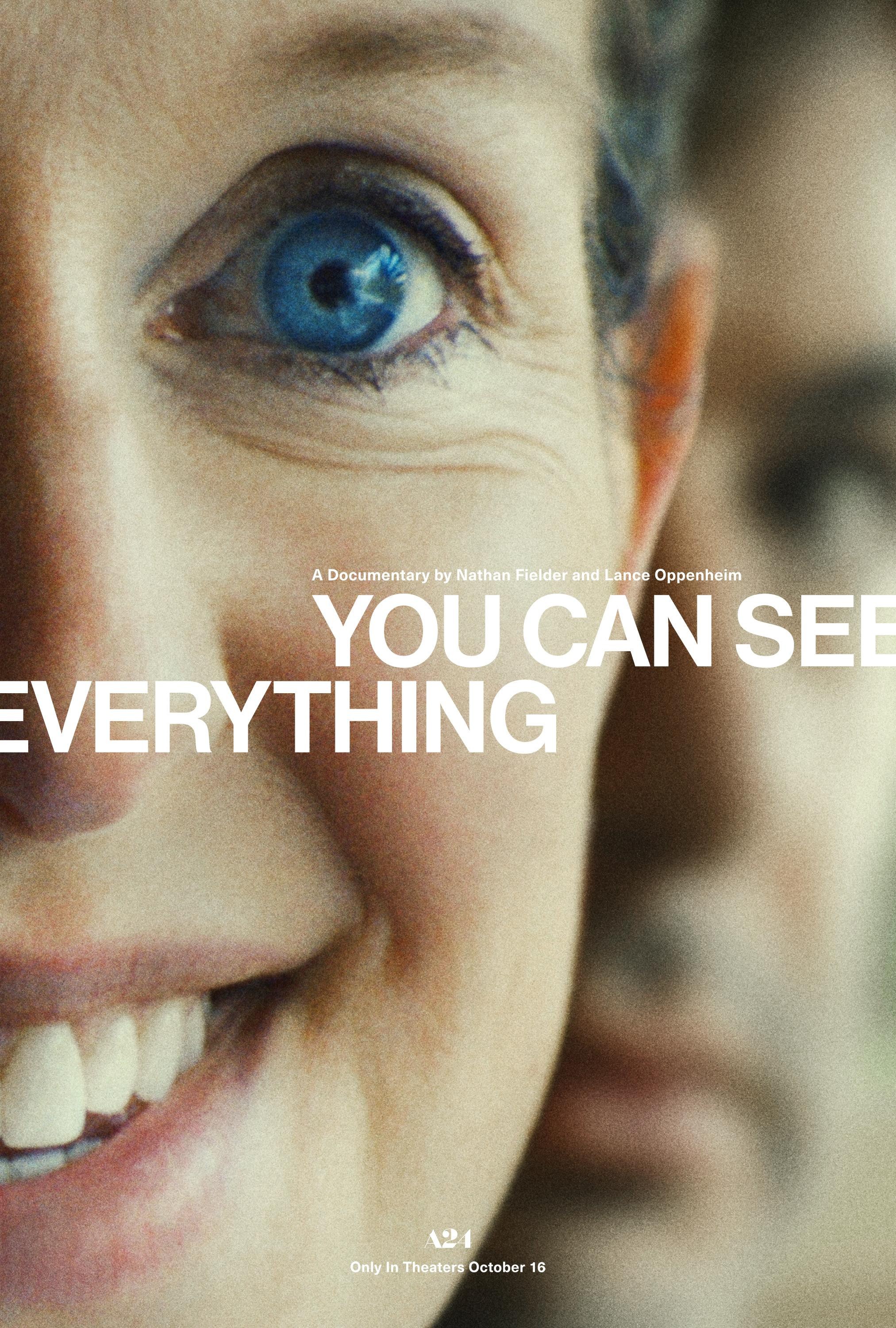 Close-up of a woman's face with bright blue eye, smiling at camera for documentary film poster
